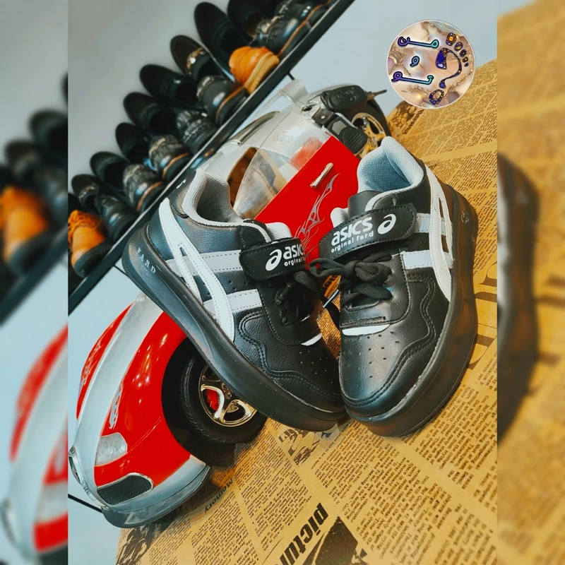 کفش اسپرت پسرانه asics مشکی با تزیینات رنگی ازسایز31تا37