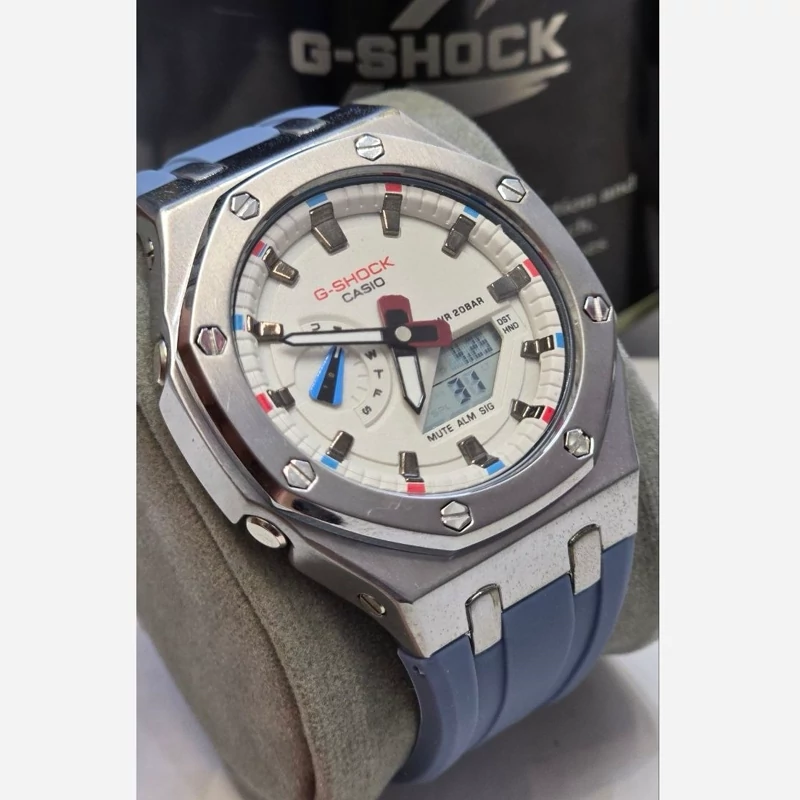 ساعت مچی جی شاک G-Shock GM-2100-1A استیل نقره ای (جیشاک GShock) تنظیم اتوماتیک با پایتخت کشورها ،اتولایت اتوماتیک