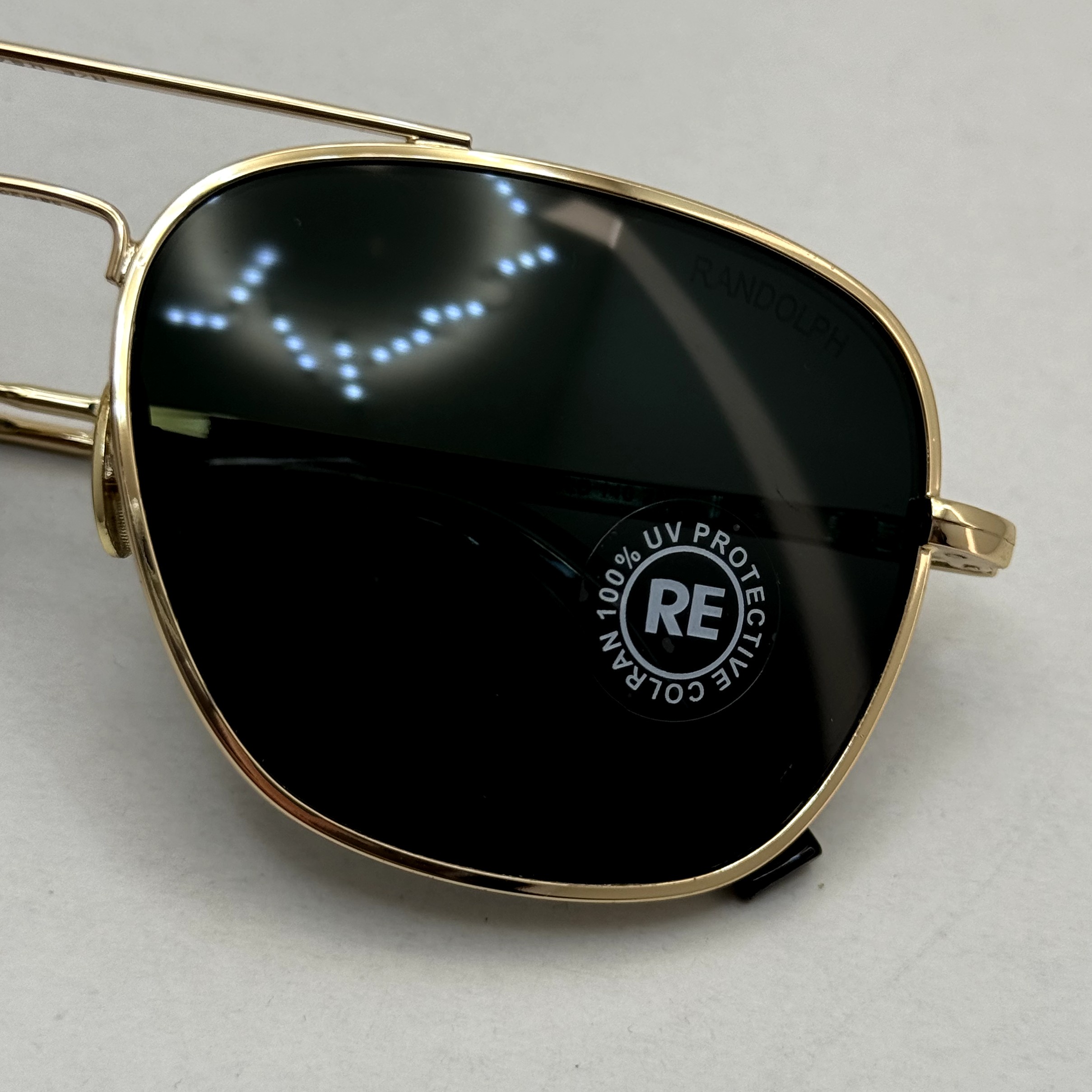 عینک آفتابی خلبانی رندولف شیشه سنگ آنتی رفلکس مشکی فریم طلایی فول پک RANDOLPH AVIATOR RE 58 24K GOLD